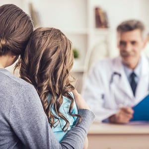 Little girl with her mother at the doctor