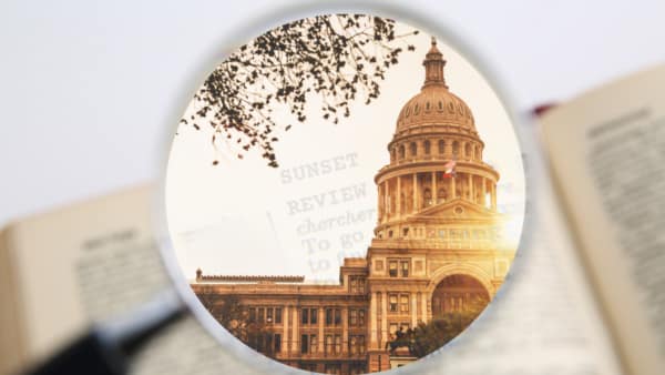 legislative interim newsletter capitol under magnifying glass
