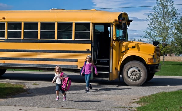 Children Running Off Of Bus