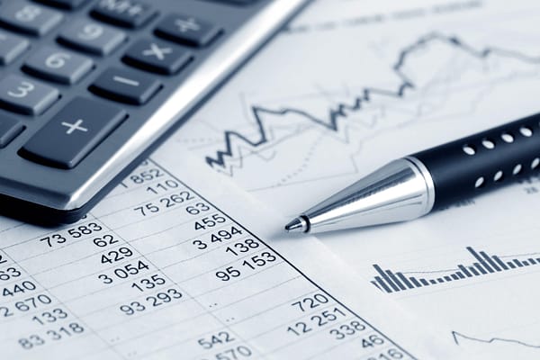 Spreadsheet, charts, calculator, and a pen.