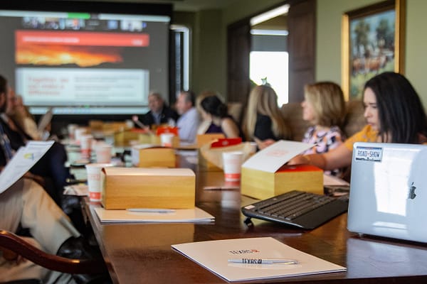 Texas Road Show participants at a conference table