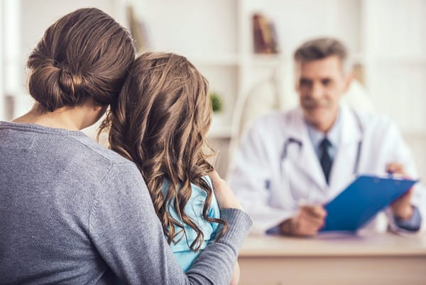 Little girl with her mother at the doctor