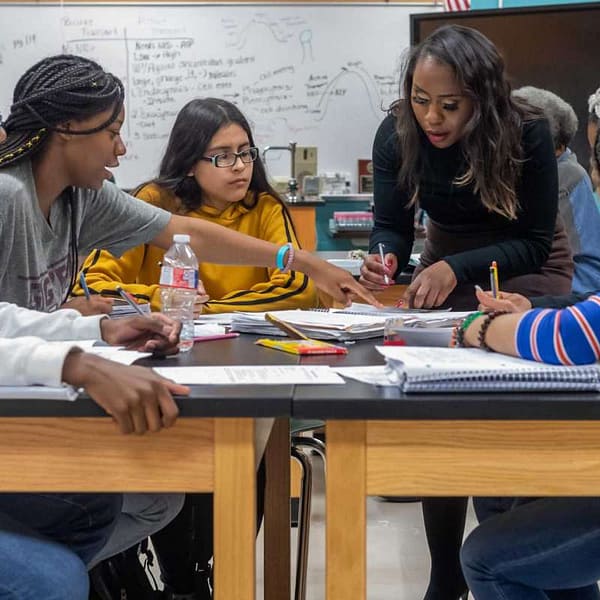 High school students working together at a table