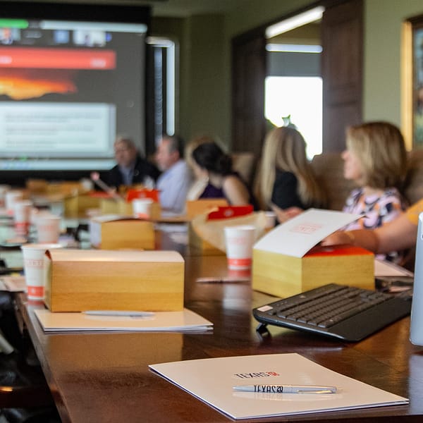 Texas Road Show participants at a conference table