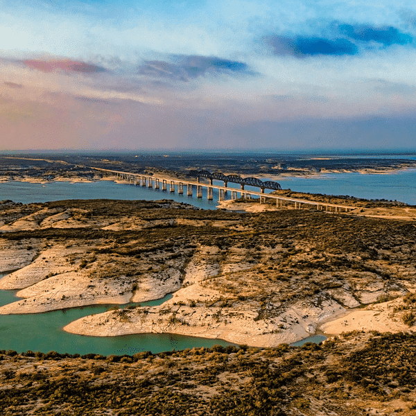 Aerial view of Amistad Reservoir with the Governor's Landing Bridge in Texas at sunset