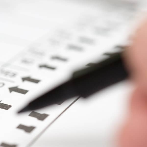 Voter preparing to make selections on ballot propositions